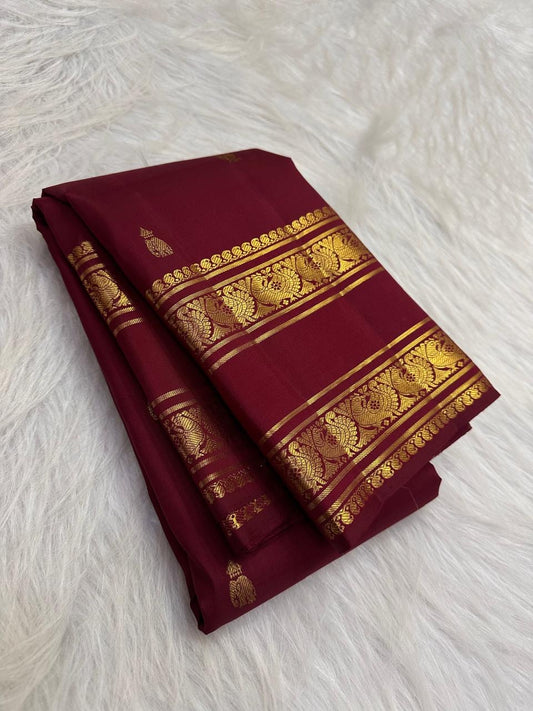 Deep maroon pure silk Kanchipuram Rettapet saree, draped front view