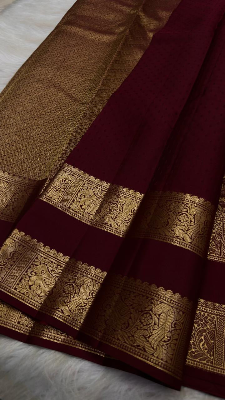 Maroon Kanchipuram saree with gold buttas and Vanasringaram