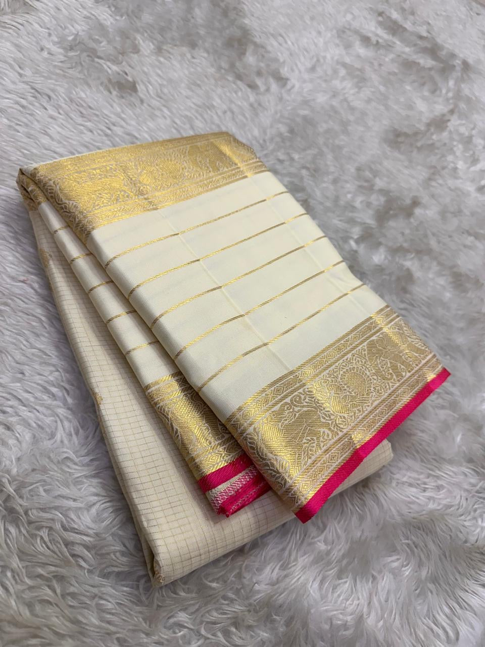 Warm Ivory pure mulberry silk saree with fine zari checks and layered Varisaipet border.