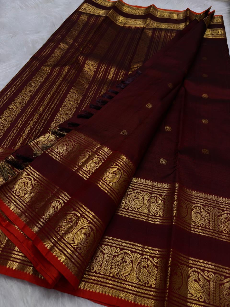 Deep maroon Rettapet Kanjipuram saree with antique gold zari border detail