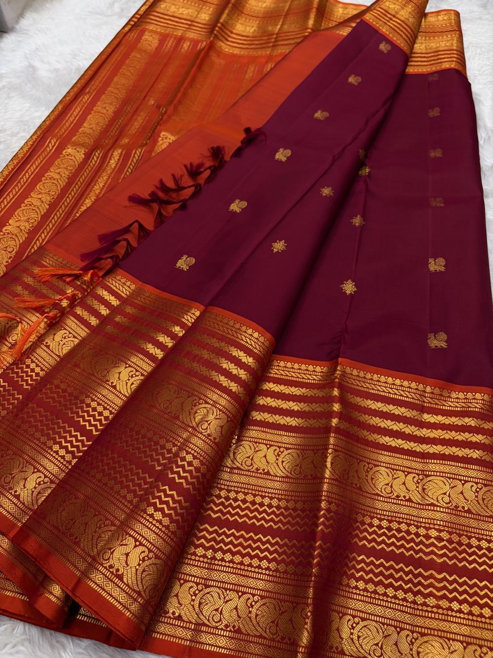 Deep maroon handwoven pure silk Kanchipuram saree with Varisaipet Mayil Butta and rust orange border — Idam Living