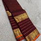 Deep Maroon pure silk Kanjivaram Varisaipet saree with antique-gold Mayil zari border.