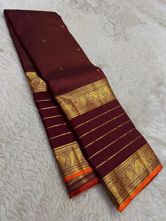 Deep Maroon pure silk Kanjivaram Varisaipet saree with antique-gold Mayil zari border.