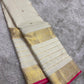 Antique-gold Mayil border with botanical detailing on Warm Ivory Kanchipuram silk.