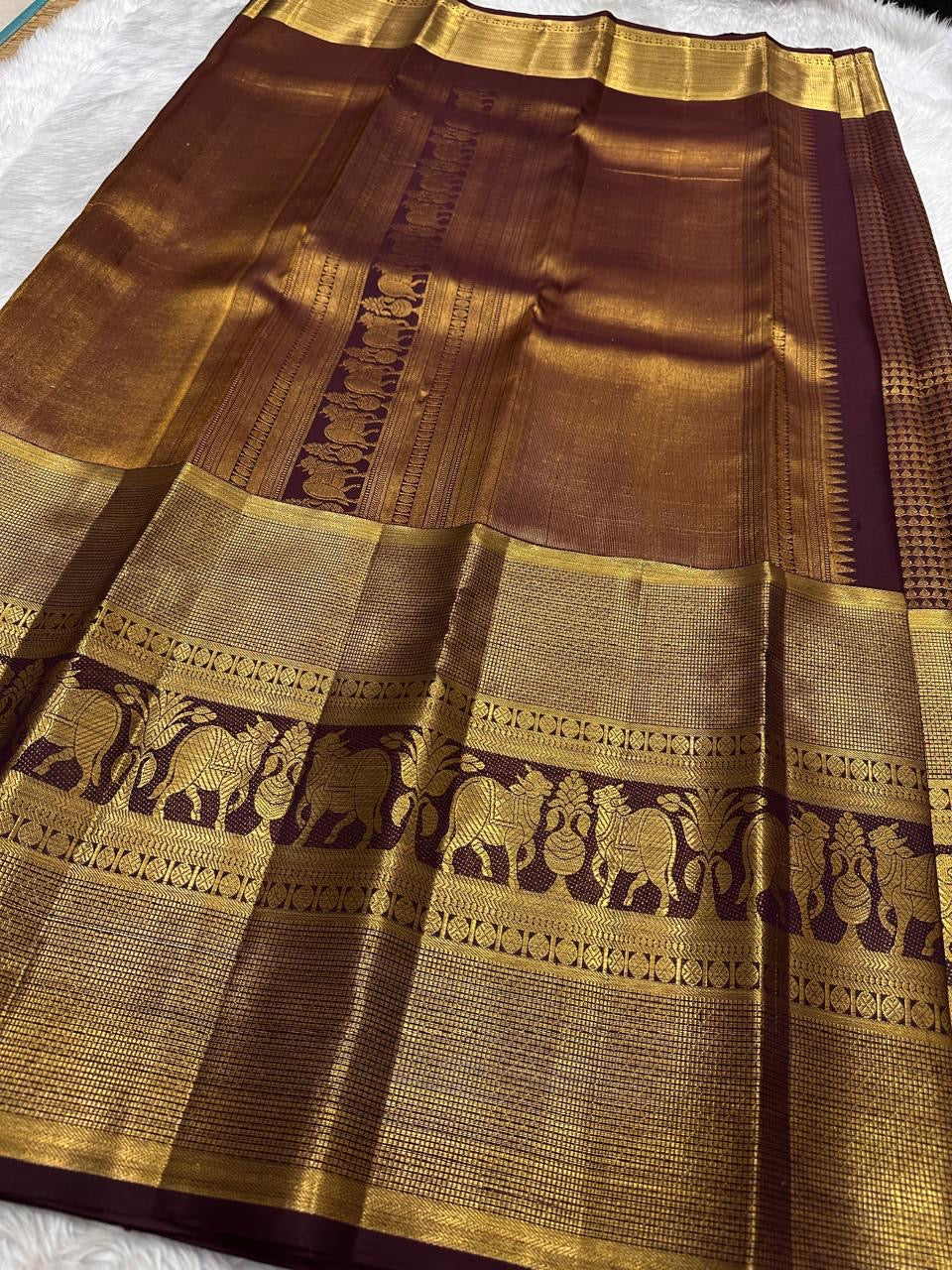 Deep Maroon Brown pure silk Kanjivaram Zari Kattam saree with broad antique-gold elephant border.