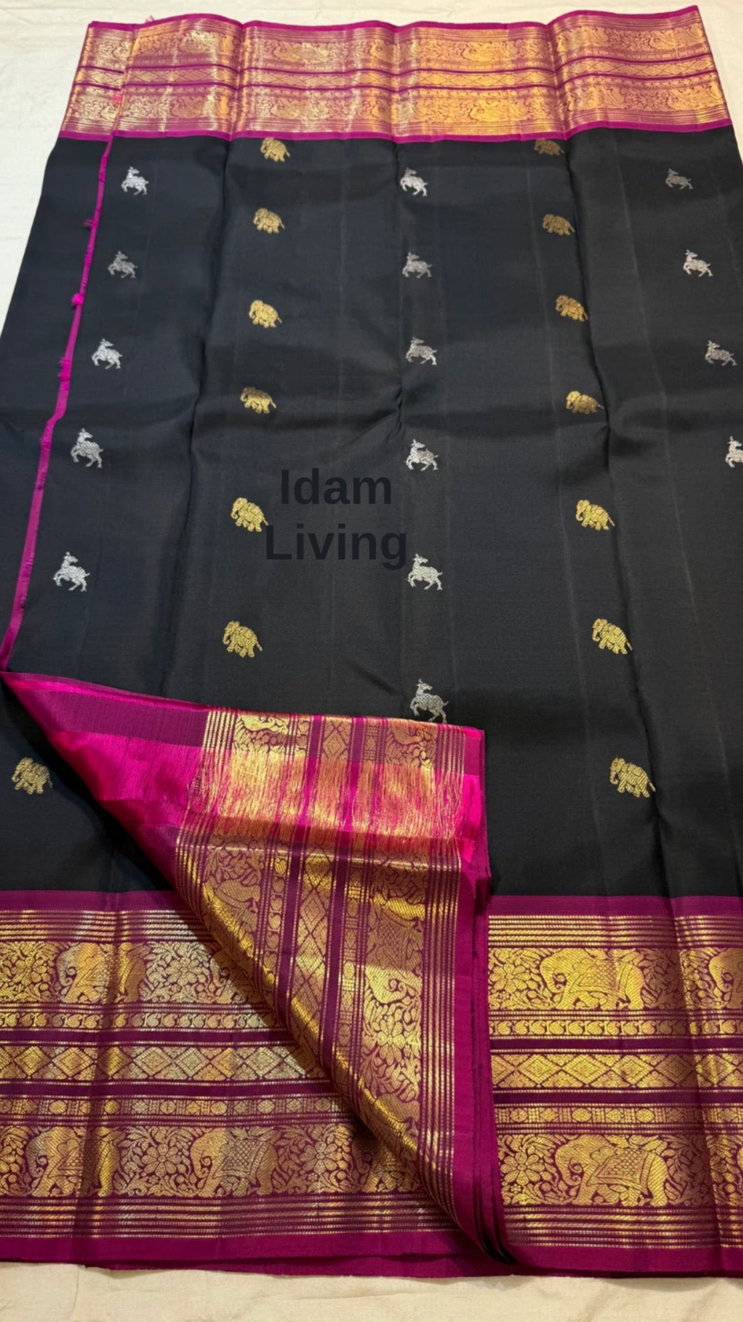 Deep Midnight Black Kanchi Pattu Saree — magenta Varisaipet border with Yaanai elephant and Maan deer motifs