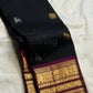 Deep Midnight Black Kanchi Pattu Saree — body close-up showing scattered gold zari buttas