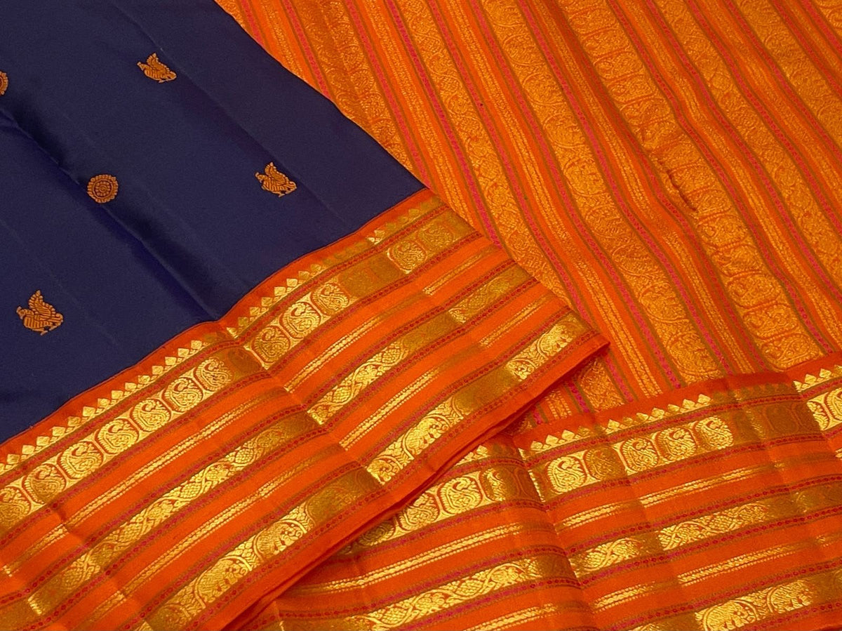 Deep Navy Blue Pure Silk Kanjivaram Korvai saree with radiant orange border