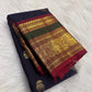 Deep navy Kanchi Pattu saree with handwoven elephant zari buttas — Idam Living.