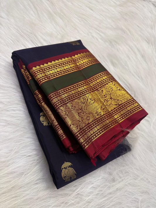 Deep navy Kanchi Pattu saree with handwoven elephant zari buttas — Idam Living.