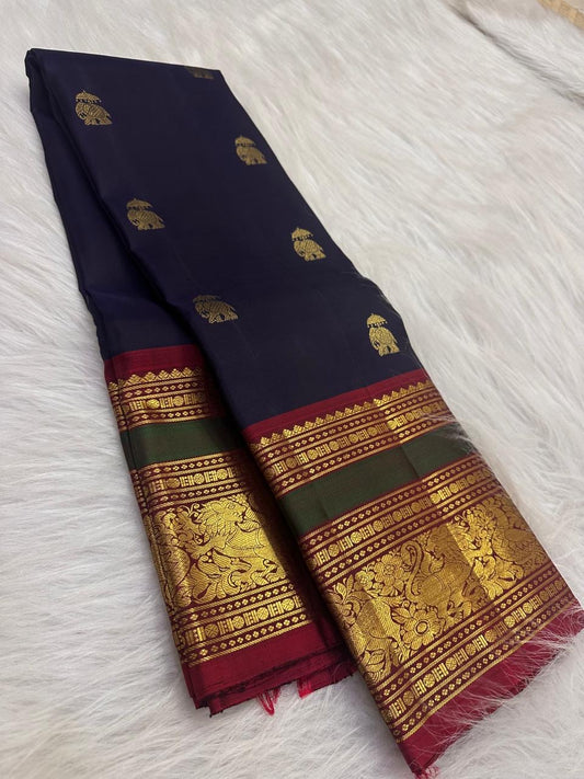 Close-up of elephant zari buttas on the deep navy Kanchi Pattu silk saree.