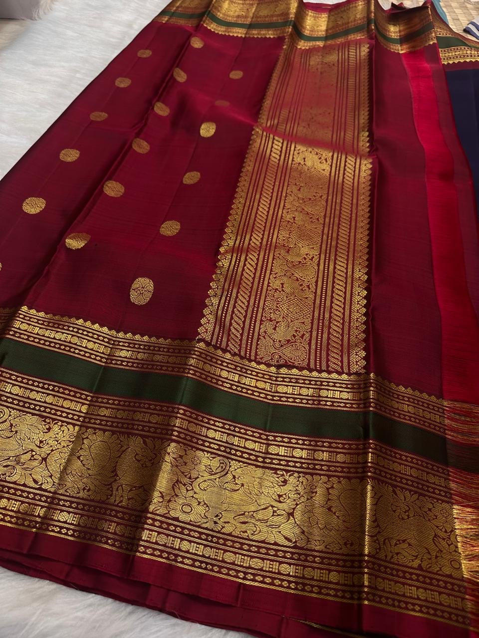 Elephant motif and geometric zari detail on the deep navy Kanchi Pattu saree border.