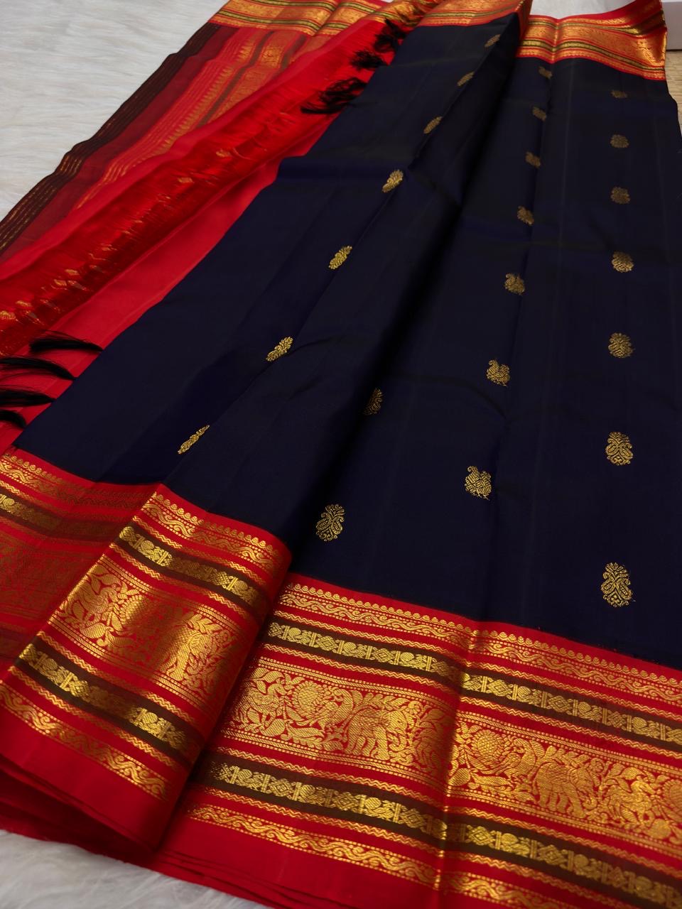 Ink Navy Blue handwoven Varisaipet saree with traditional antique-gold zari buttas.