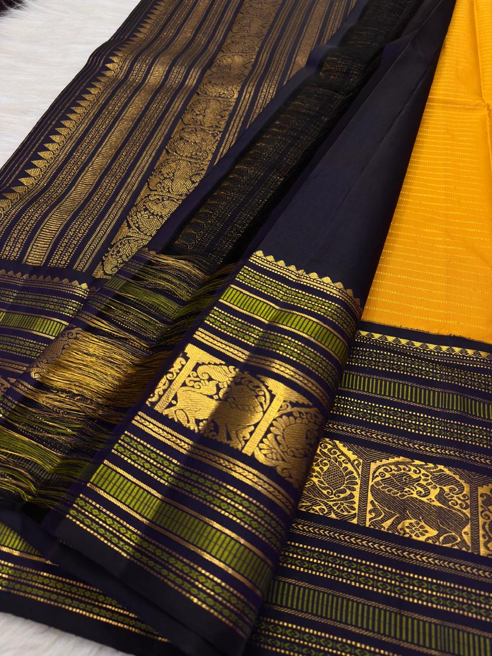Deep navy Varisaipet zari border on turmeric yellow Kanjeevaram silk saree, border detail
