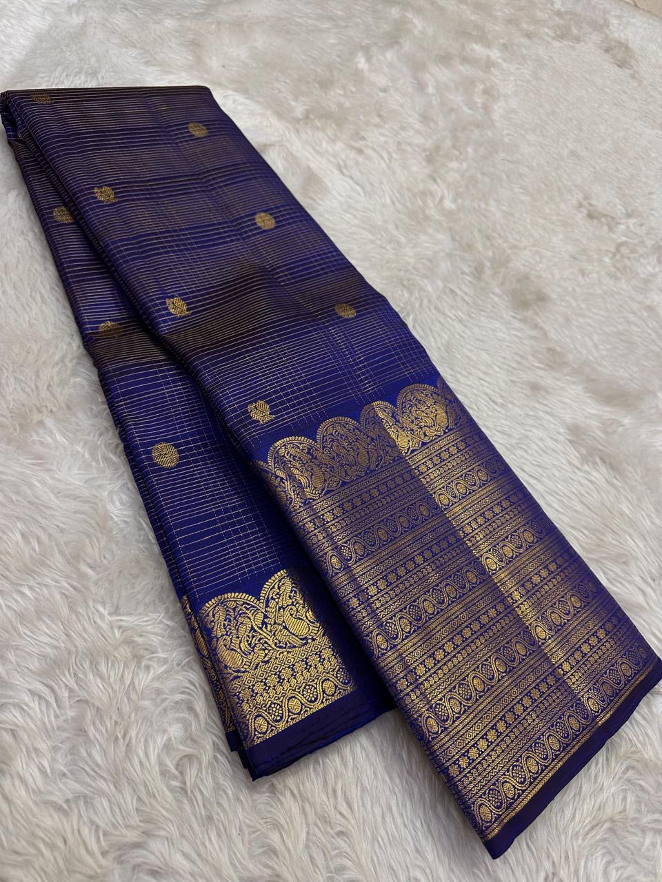 Deep Neelam Blue Pure Silk Kanchipuram Zari Kattam saree with classic-gold border.