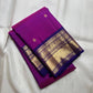 Deep Neelam blue-purple Kanchipuram border with broad classic-gold zari and floral-vine detailing.