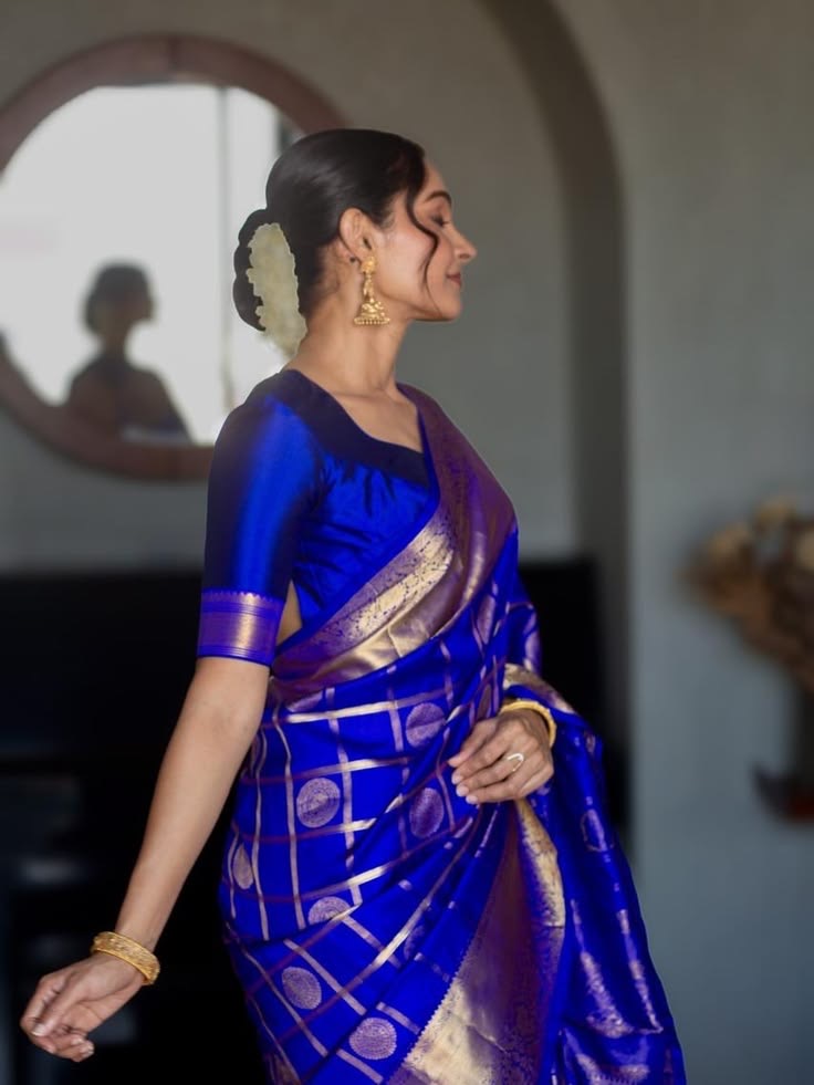 Deep Neelam pure silk Kanchipuram Zari Kattam saree with broad Yaanai classic gold zari border.