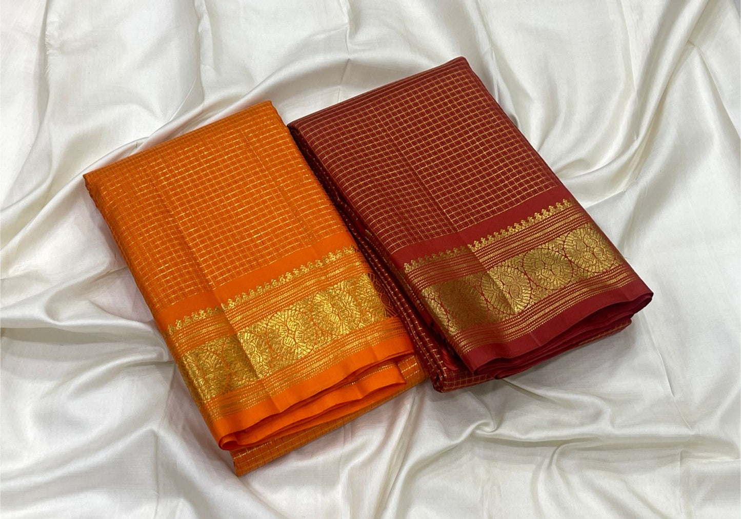 Warm gold floral medallions on Deep Saffron Orange handwoven Kanchipuram silk.