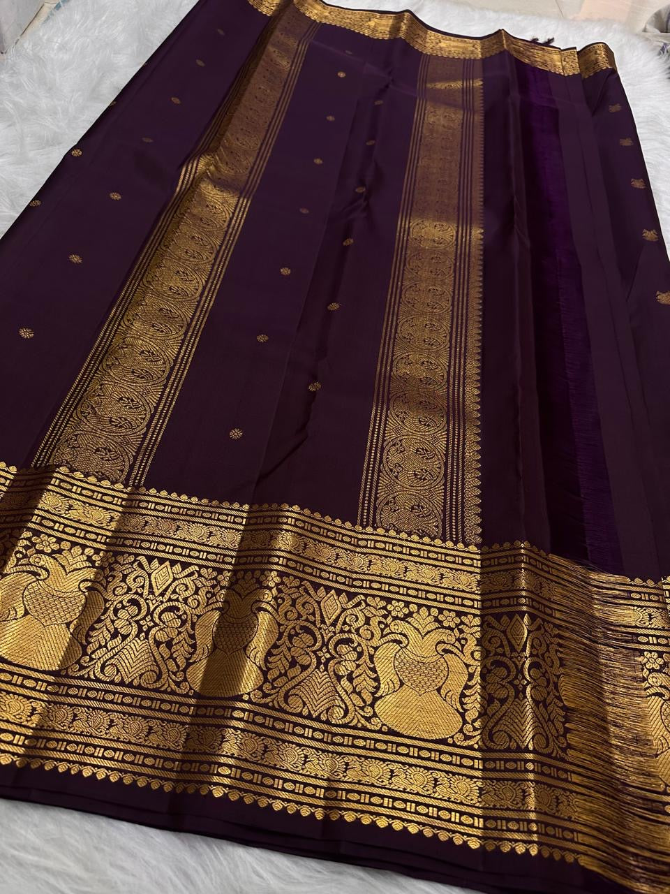 Deep Paaku Brown-Maroon Pure Silk Kanchipuram saree with delicate classic-gold zari buttas.