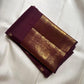 Broad Mayil-inspired classic-gold zari border against dark Paaku Kanchipuram silk.