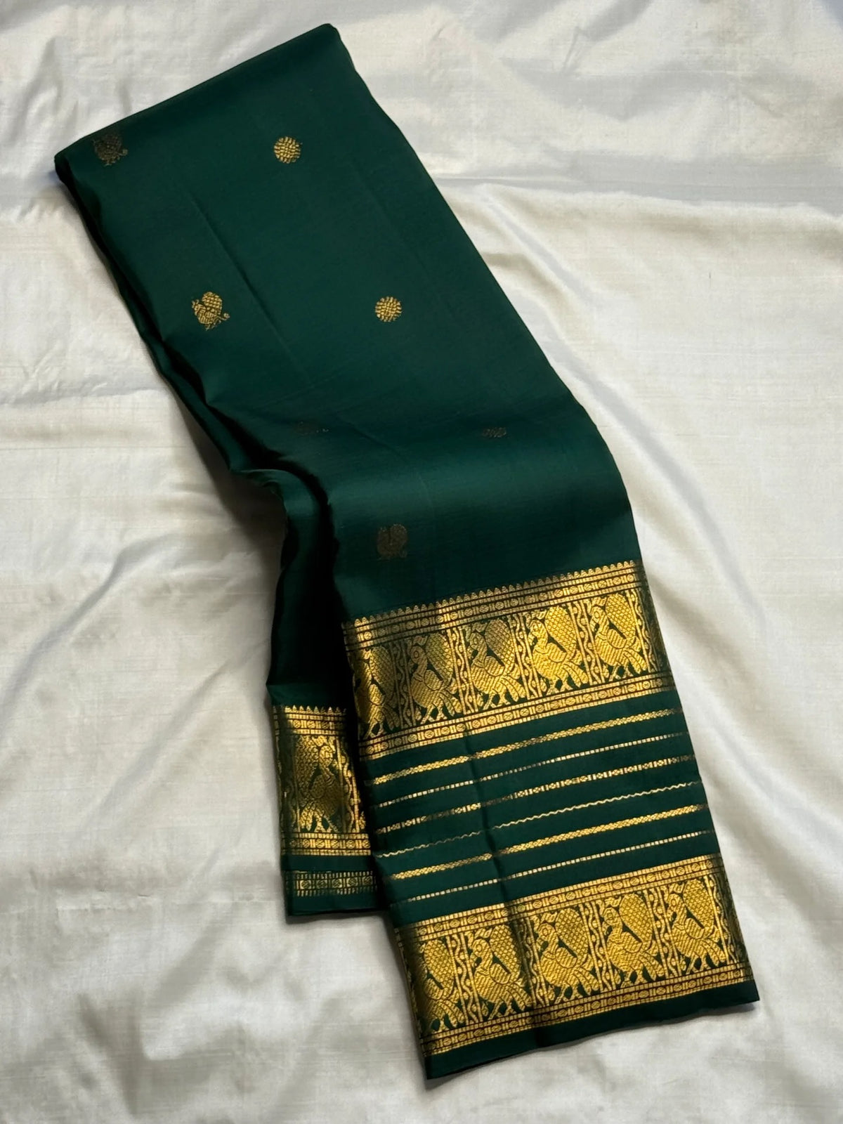 Deep forest green handwoven pure silk Varisaipet saree by Idam Living.