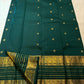 Deep Pachai Green pure silk Kanjivaram Varisaipet saree with radiant warm gold zari border.