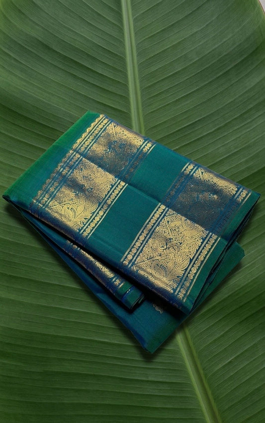  peacock teal Kanchipuram silk saree with heritage rettapet border and classic gold zari radiance