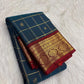 Deep Peacock Teal pure silk Kancheepuram Zari Kattam saree with gold zari checks and Deep Red accents.
