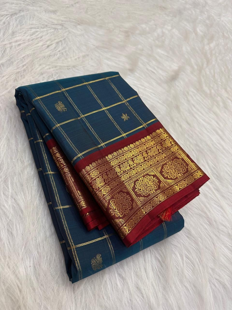 Deep Peacock Teal pure silk Kancheepuram Zari Kattam saree with gold zari checks and Deep Red accents.
