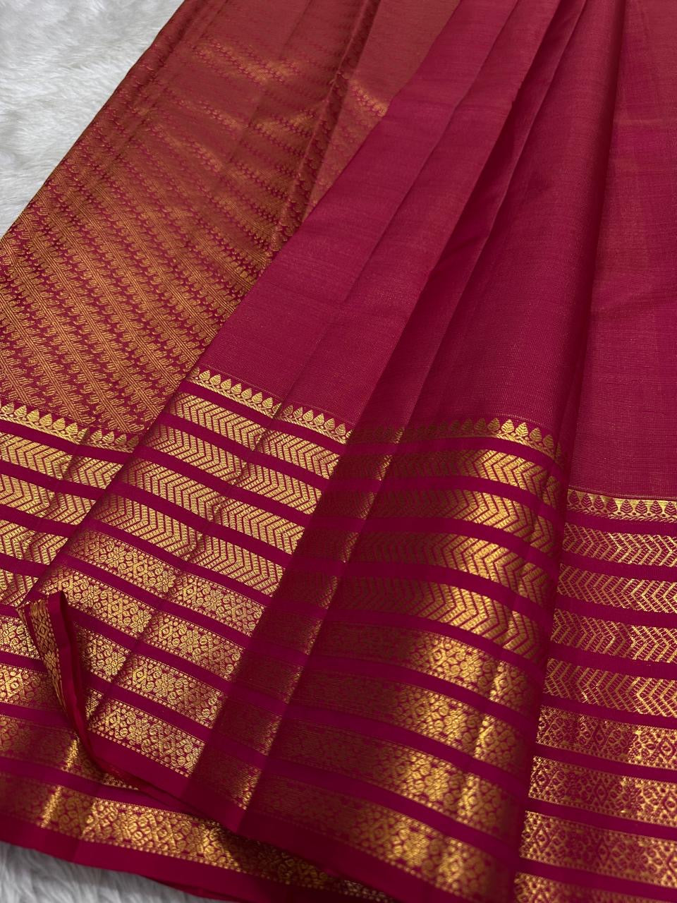 Rani Pink pure silk Kanchipuram Varisaipet saree, folded view — Idam Living