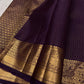 Close view of antique-gold traditional buttas on Deep Aubergine Purple Kanjivaram silk.