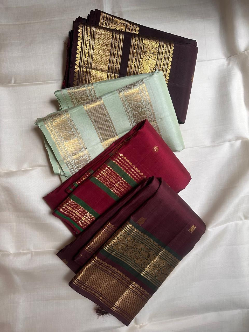 Pallu detail of Deep Plum Kancheepuram silk saree showing zari craftsmanship