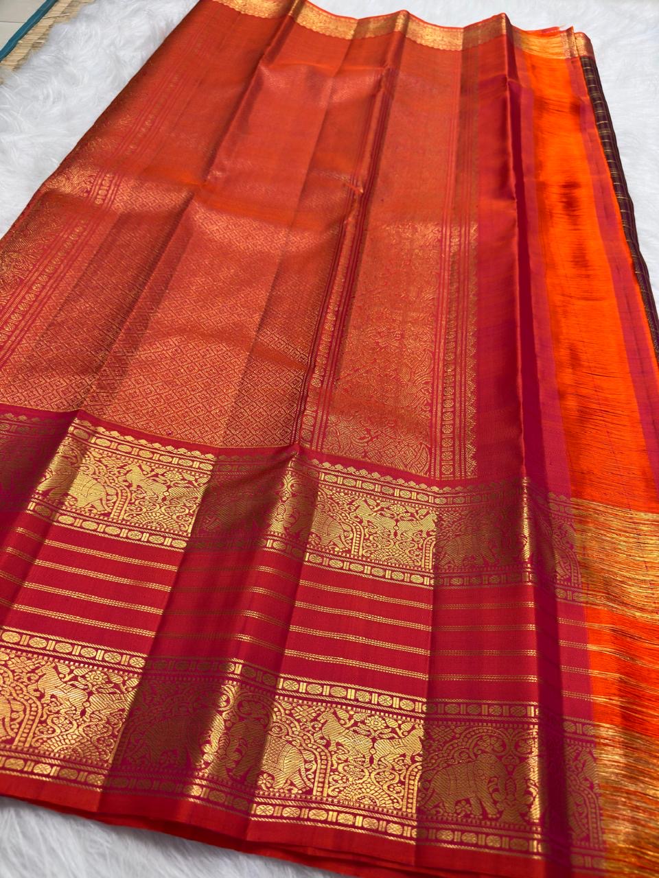 Deep Plum Handwoven Pure Silk Kanchipuram Zari Kattam Saree with Vermilion Elephant Zari Border – silk fabric close-up
