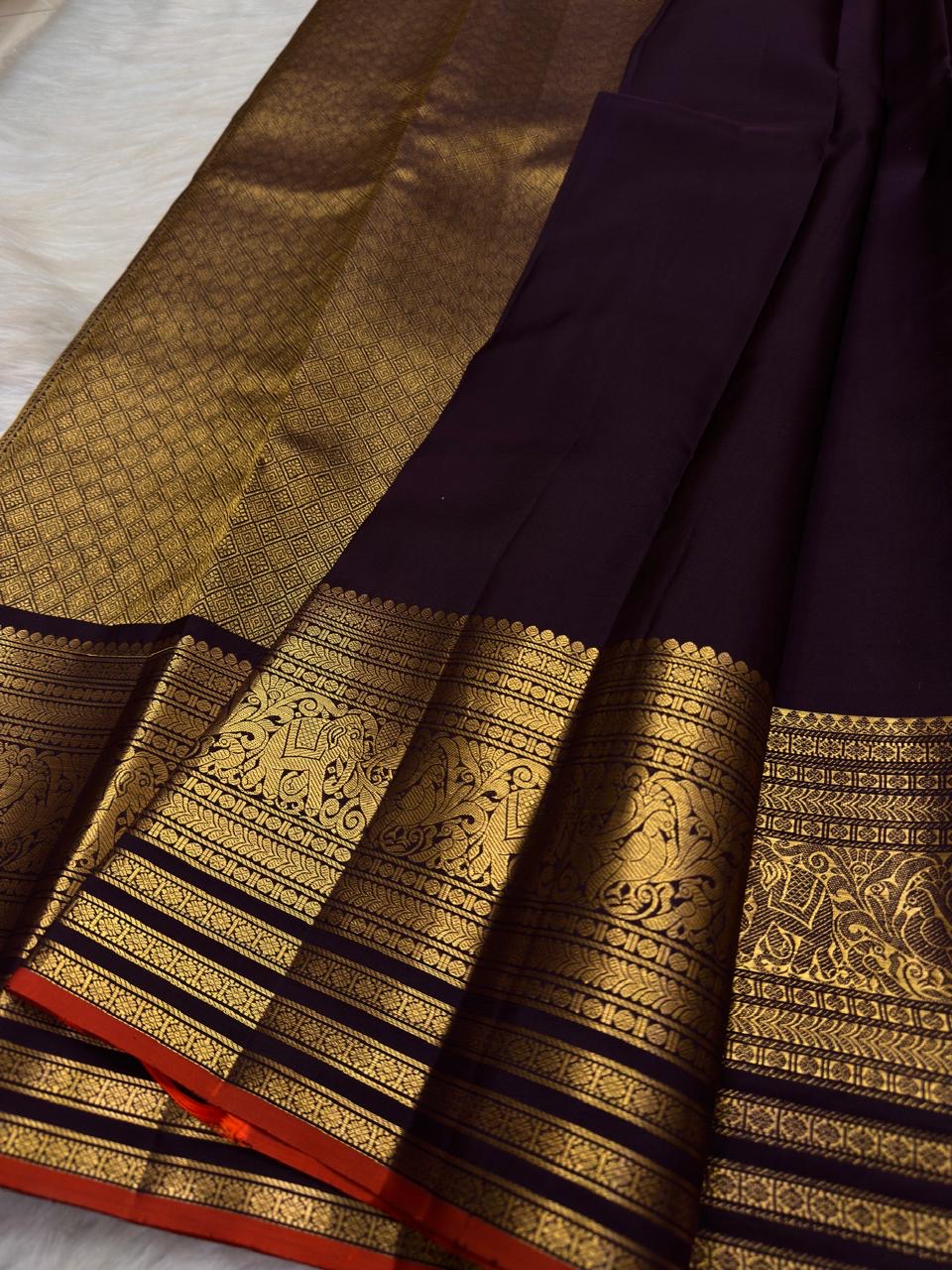 Grand antique-gold Mayil peacock border on Deep Aubergine Purple Kanjivaram silk.