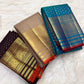 Deep Brown Kanjivaram Butta saree with broad gold zari border and fine Red selvedge.