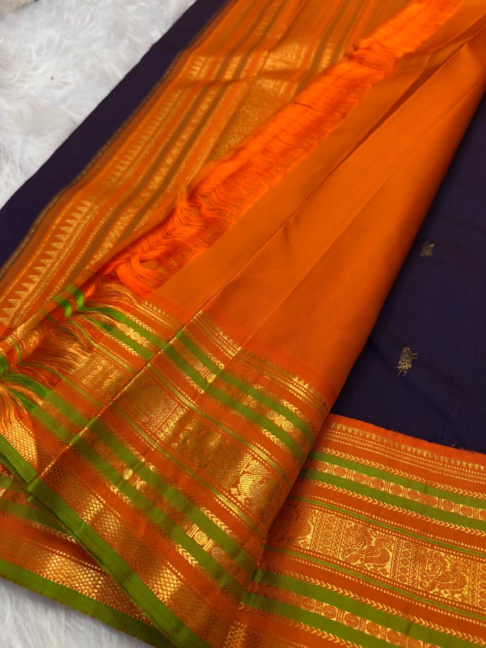 Deep Purple Kanchipuram silk saree with spaced antique-gold zari motifs and layered Varisaipet border.