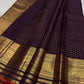 Close view of fine antique-gold zari buttas on Deep Aubergine Purple Kanjivaram silk.