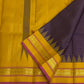 Deep Purple Kanjivaram silk saree with gold Zari Kattam grid folded to show the pallu
