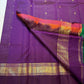 Kanchana Purple Kanchi Pattu border with gold zari ornament and emerald-green finishing edge.