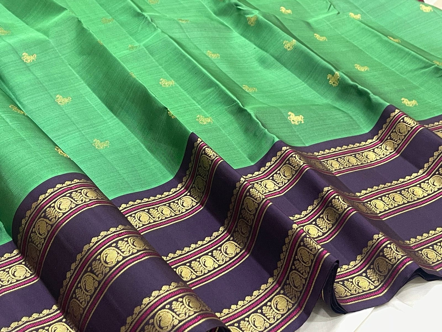 Emerald Green and Deep Purple handwoven pure silk Kanchipuram saree.