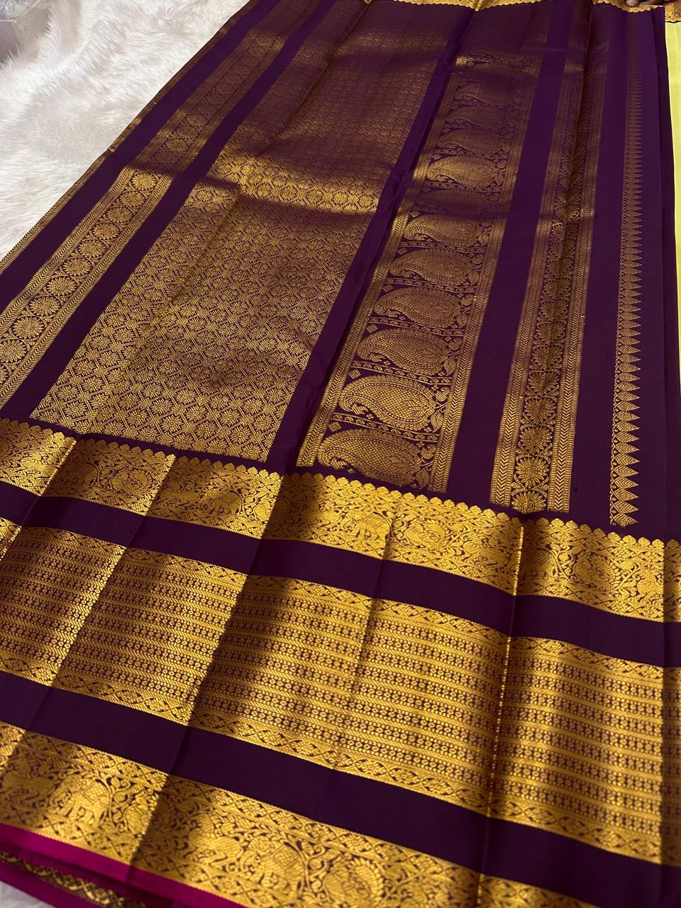 Deep purple Kai Korvai border of lime chartreuse Kanjipuram saree with dense Yaanai Maanga and geometric antique gold zari array