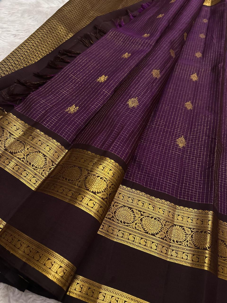 Deep purple Kanchipuram saree showing the Rettapet border and gold-zari registers.