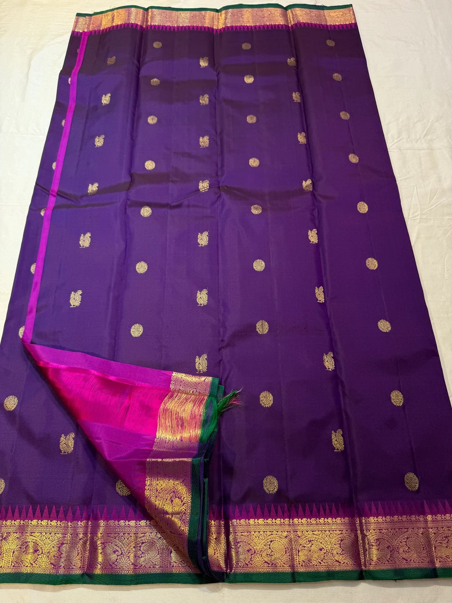 Magenta korvai border with gold zari vanasringaram motifs on deep purple Kanchipuram saree — Idam Living