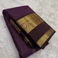 Deep purple Pure Silk Kanchipuram with fine gold Zari Kattam lines and scattered zari buttas.