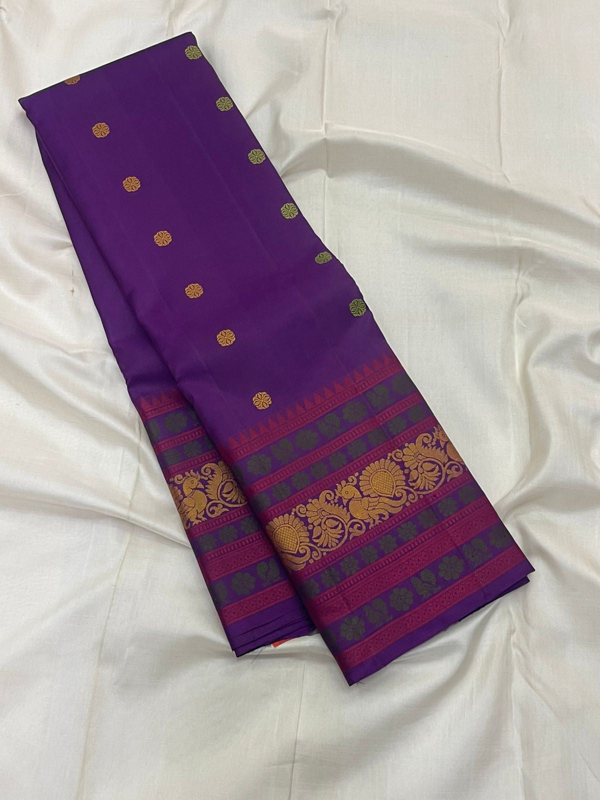 Close-up of kamalam butta in gold zari on deep purple Kanjeevaram double warp pure silk saree — Idam Living