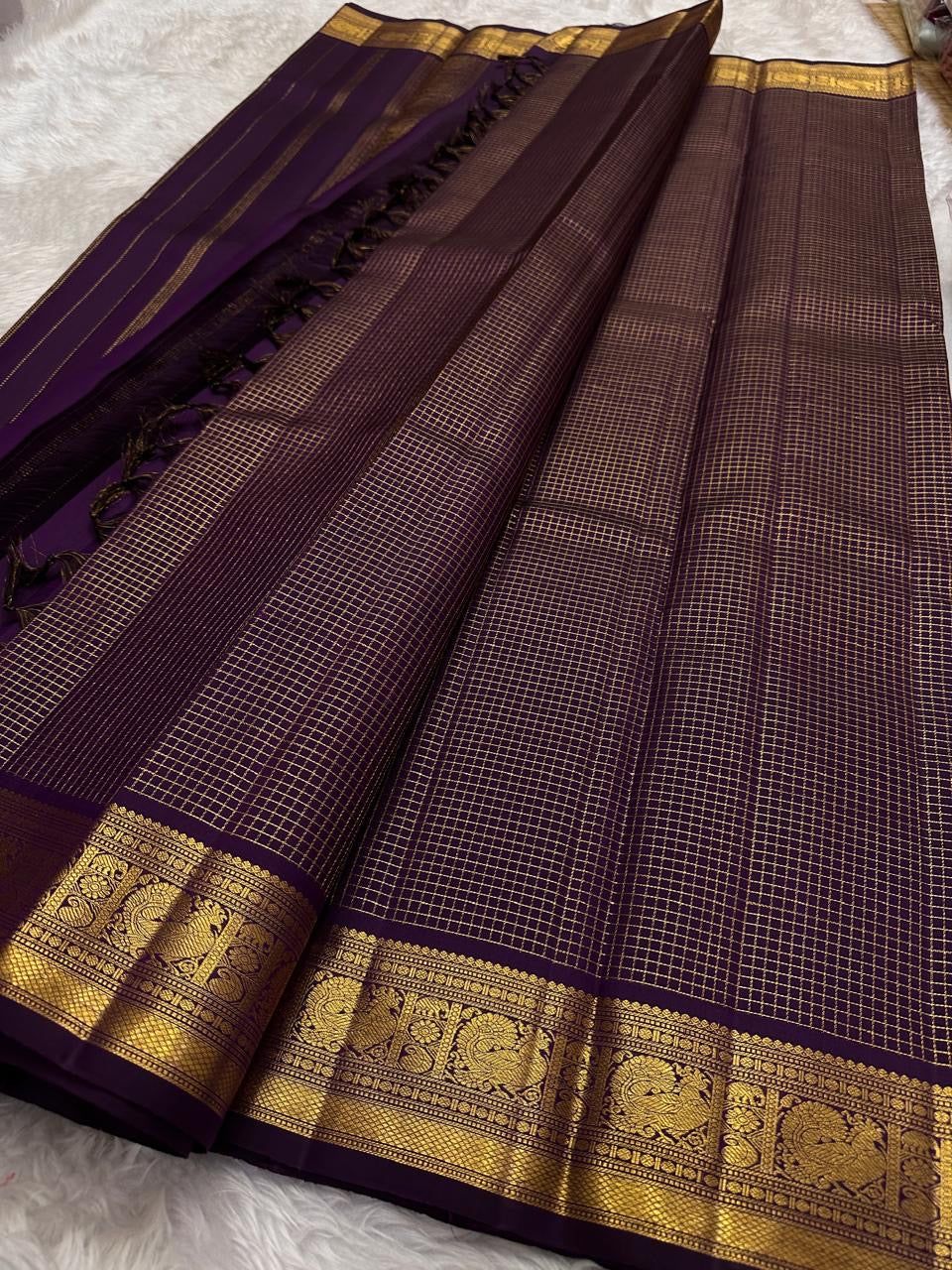 Full pallu of deep purple Kanjeevaram saree with vertical gold zari stripes and Maanga Mayil border panels — Idam Living