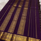 Deep purple Kanjipuram Zari Kattam saree folded flat showing luminous gold check weave and grand border — Idam Living