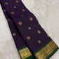 Close view of gold zari buttas on Deep Purple Pure Silk Kanchipuram