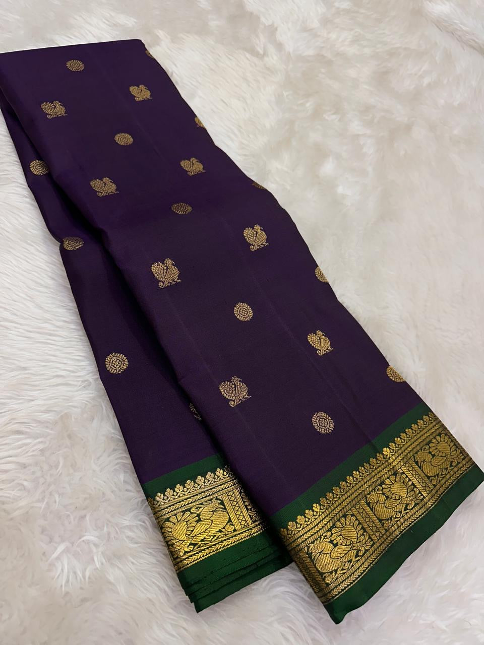 Close view of gold zari buttas on Deep Purple Pure Silk Kanchipuram