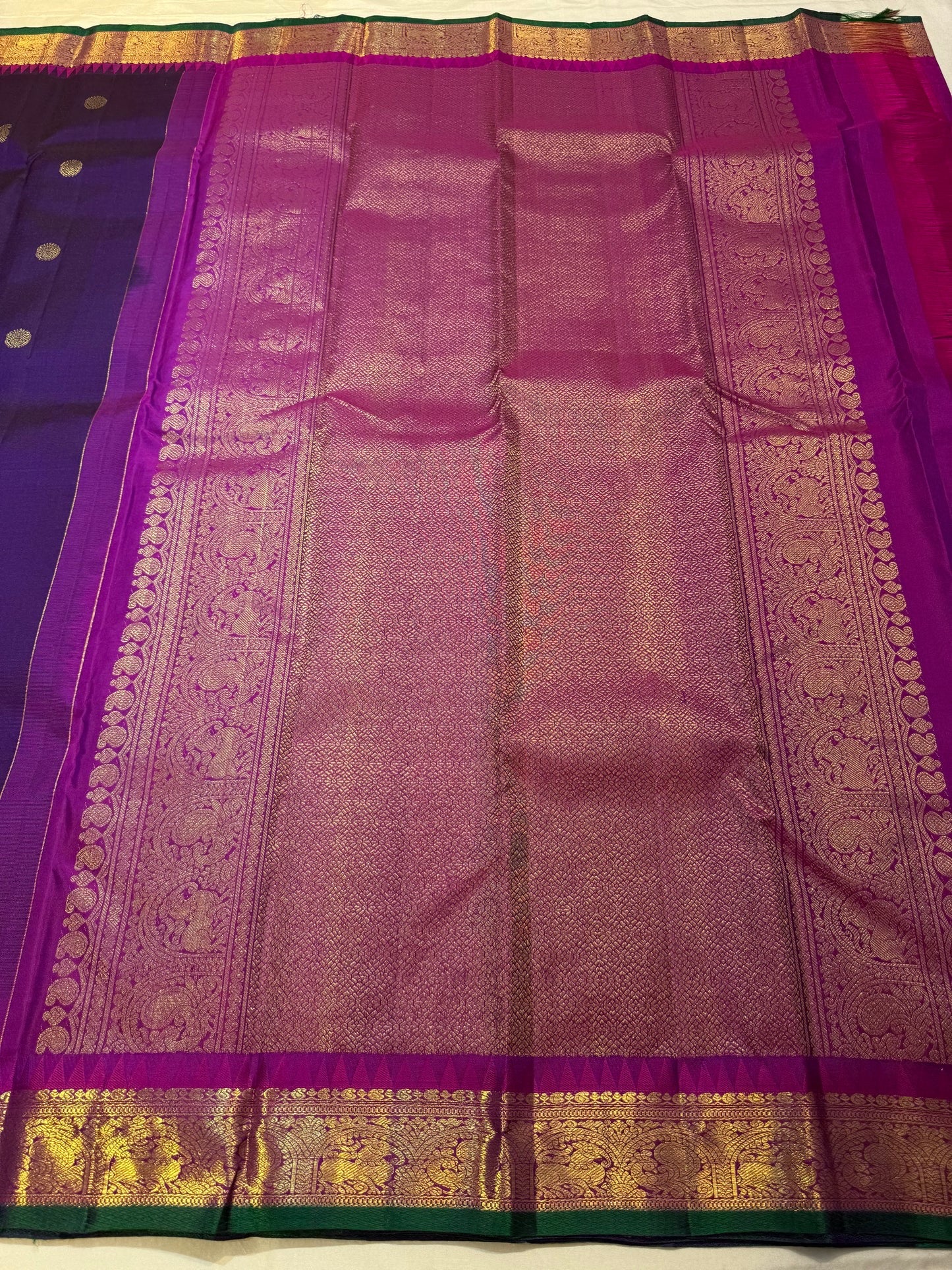 Full view of deep purple Kanjivaram silk saree with mayil butta and magenta korvai border — Idam Living